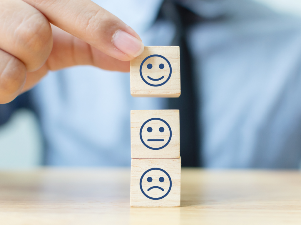blocks being stacked depicting Sadness, contempt, and happiness