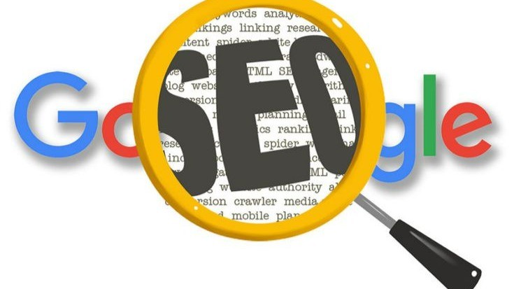 Google hovered over by a magnifying glass revealing the words SEO