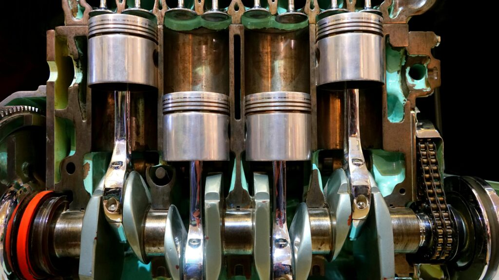 Inside of an engine displaying the pistons in different positions.