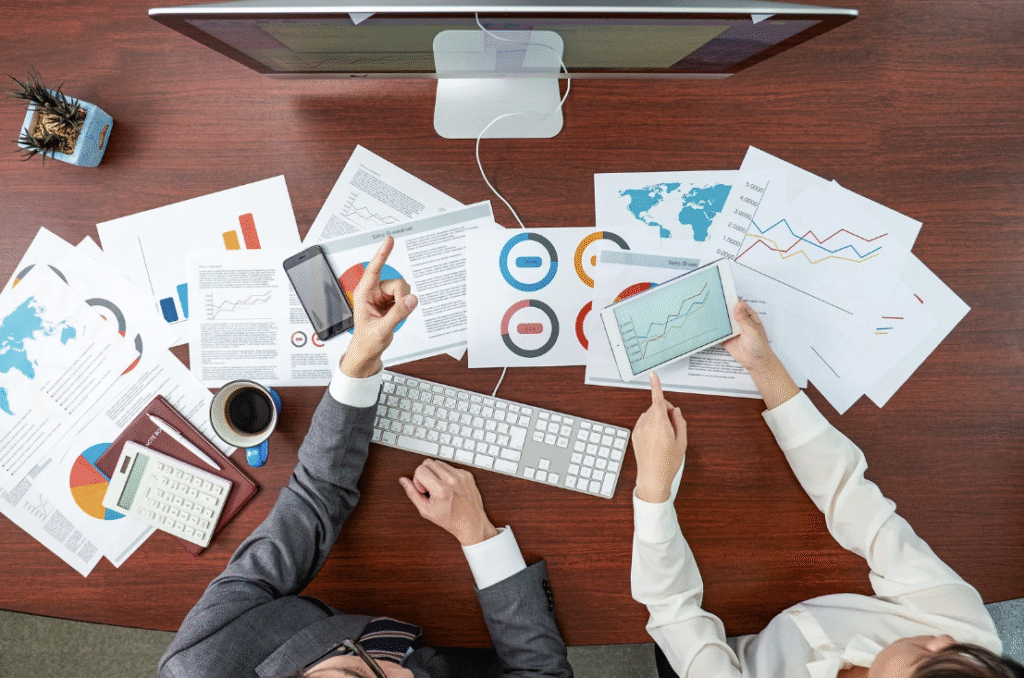 Man and woman examining ad campaign results.