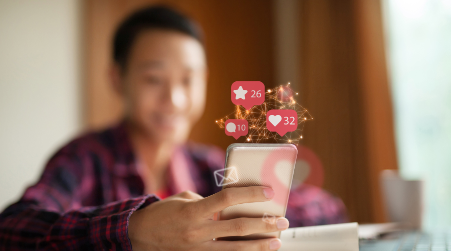 Person with a phone and a blur with comments